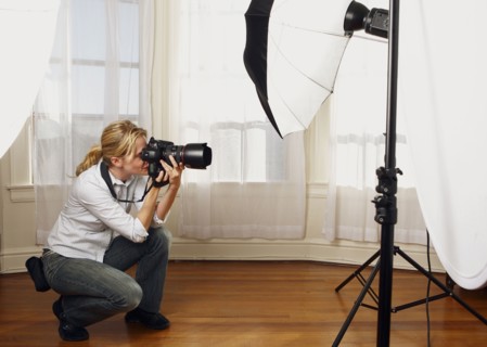 Caucasian photographer working in studio