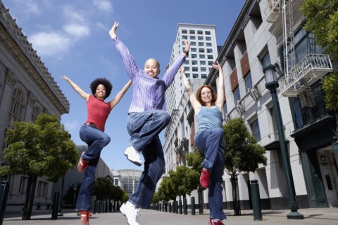People dancing on city street
