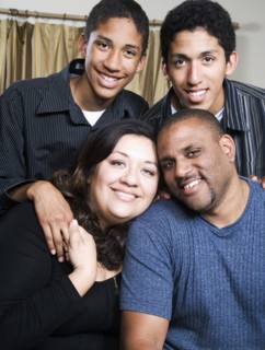 Parents and children smiling in living room
