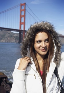 Mixed race woman standing in front of Golden Gate Bridge