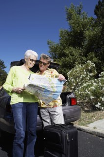 Senior Caucasian couple reading roadmap