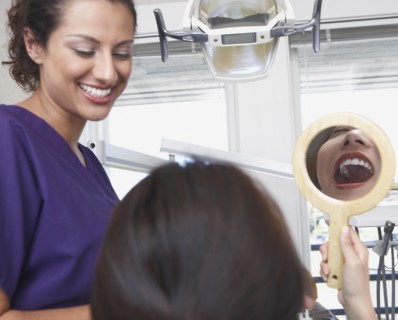 Dental nurse talking to patient