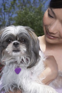 Chinese woman holding dog