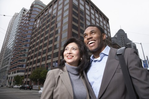 Business people standing on city street
