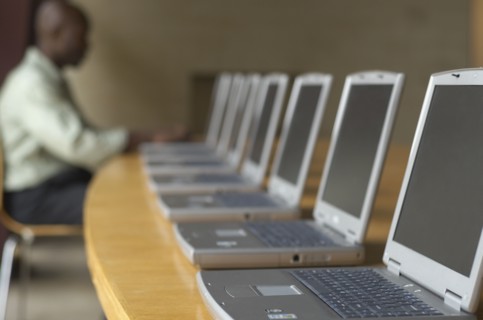 African man using laptop at computer lab