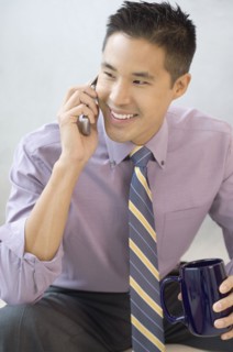 Asian businessman talking on cell phone