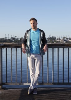 Caucasian man leaning at waterfront