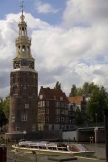 Historical landmark and tour boat in Amsterdam