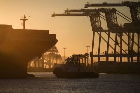 Tugboat and container ship of port of Oakland