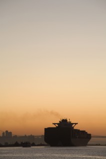 Tugboat and container ship in port of Oakland