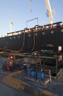 Oil tanker ship docked in industrial harbor