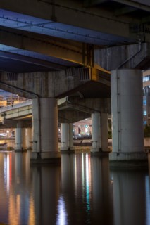 Highway overpass pillars in urban river