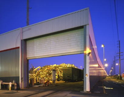 Open garage door at junkyard