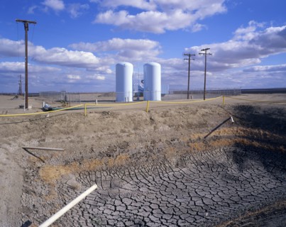 Dry drainage ditch near silos