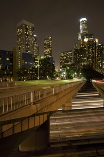 Bridge over lights on urban highway at night