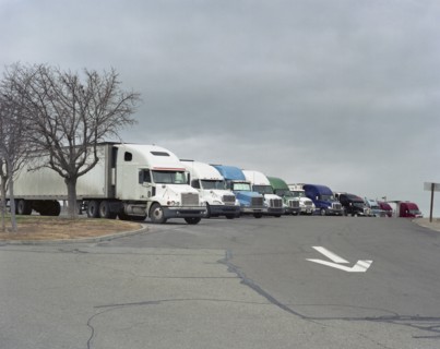 Row of parked semi-trucks
