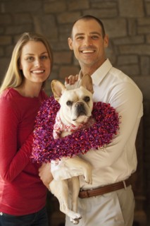 Caucasian couple holding dog