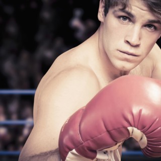 Caucasian boxer with fists raised