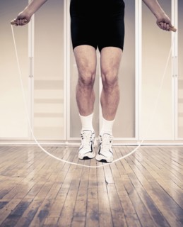 Man jumping rope indoors