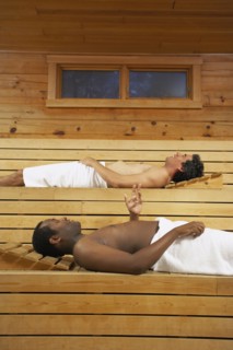 Two multi-ethnic men relaxing in sauna