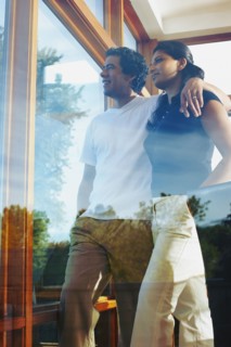 Couple looking through window