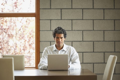 Man typing on laptop