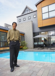 Man standing on patio of house