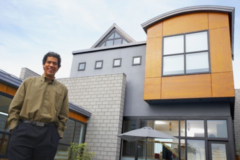 Man standing in front of house