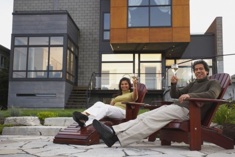 Couple toasting in deck chairs