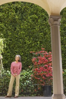 Smiling woman standing in garden
