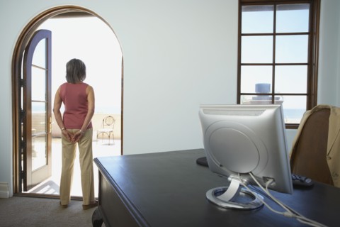 Businesswoman standing in doorway of office
