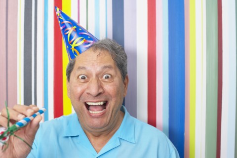 Hispanic man in party hat