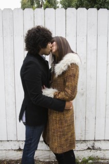 Couple in retro clothing kissing