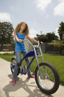 Mixed race girl on bicycle