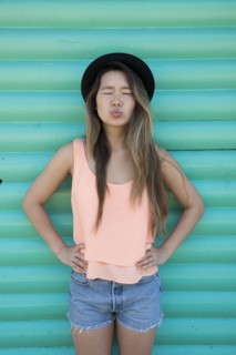 Asian woman blowing a kiss