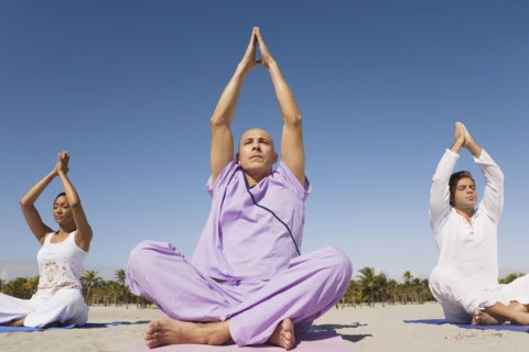 Hispanic people practicing yoga