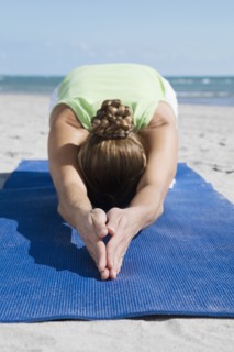 Hispanic woman practicing yoga