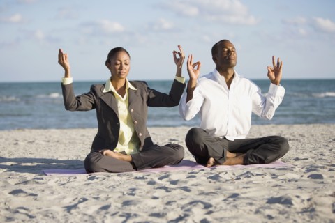 Multi-ethnic businesspeople meditating