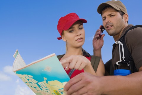 Hispanic couple looking at map