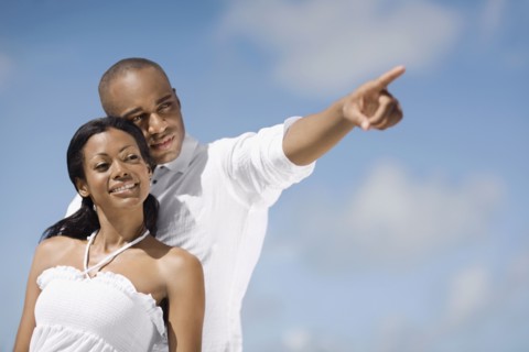 African man pointing for girlfriend