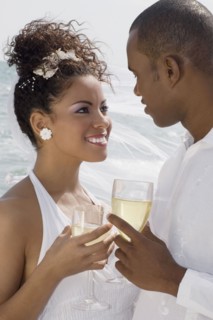 Multi-ethnic bride and groom smiling at each other