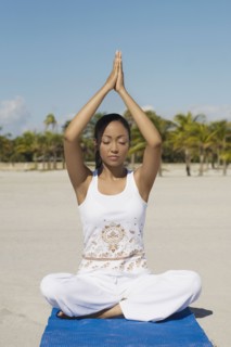 Hispanic woman practicing yoga