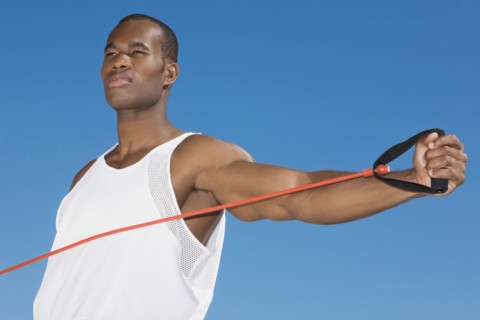 African man stretching with exercise band