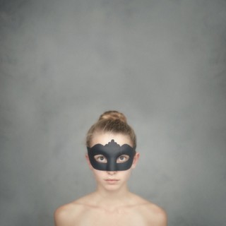 Caucasian girl wearing black mask