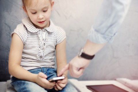 Caucasian father and daughter using digital tablet