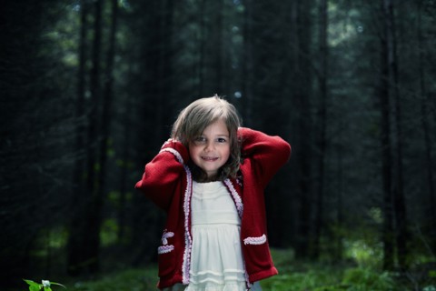 Caucasian girl smiling in forest