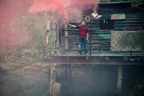 Caucasian man spraying pigment powder
