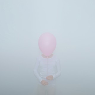 Caucasian teenage girl holding balloon