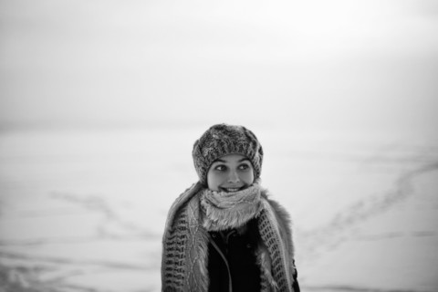 Caucasian teenage girl wearing scarf in snow