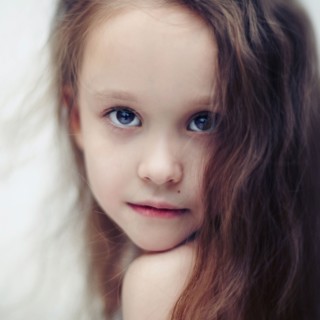 Caucasian girl looking over her shoulder